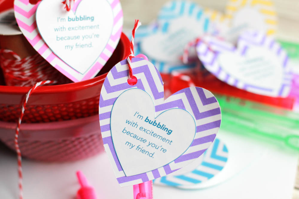 a bunch of Easy Valentine's Day Bubble Favors with store bought bubble wands and a free printable you can print right from here