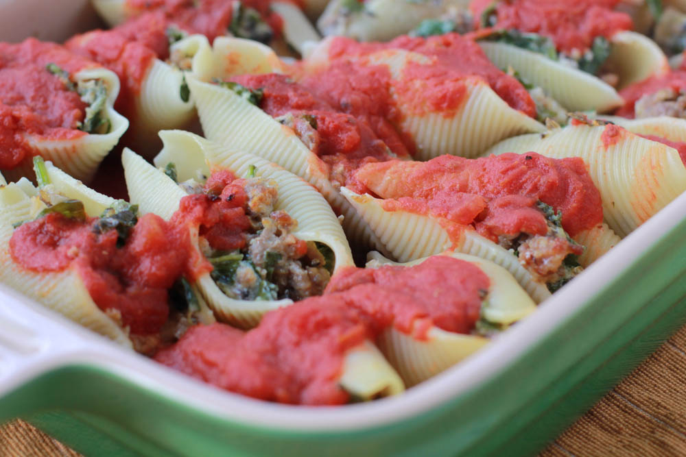 Italian Sausage Stuffed Shells, y'all! Filled with veggies, it's a great way to sneak those veggies into those picky eaters.