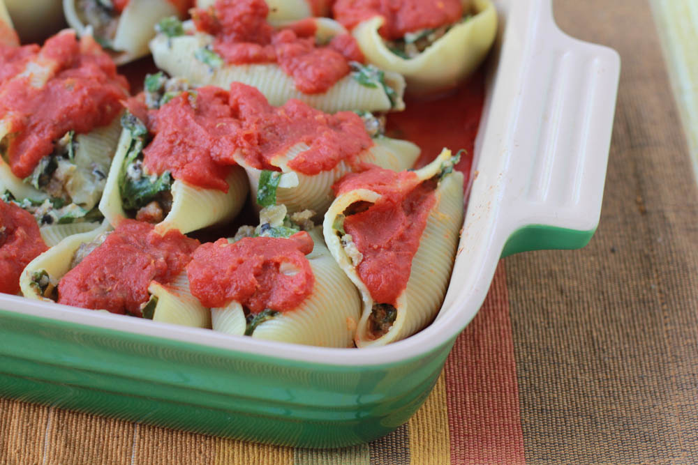 Italian Sausage Stuffed Shells, y'all! Filled with veggies, it's a great way to sneak those veggies into those picky eaters.