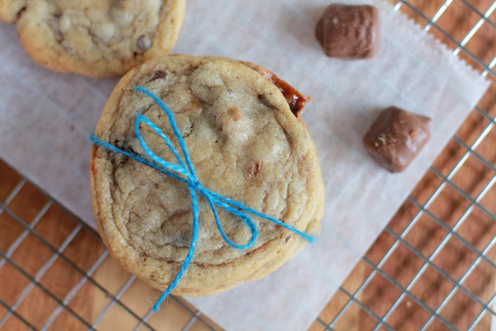 Chocolate Chip TWIX Cookies - a traditional chocolate chip cookie with pieces of Twix throughout. Chocolate Chip TWIX Cookies are perfect for sharing!