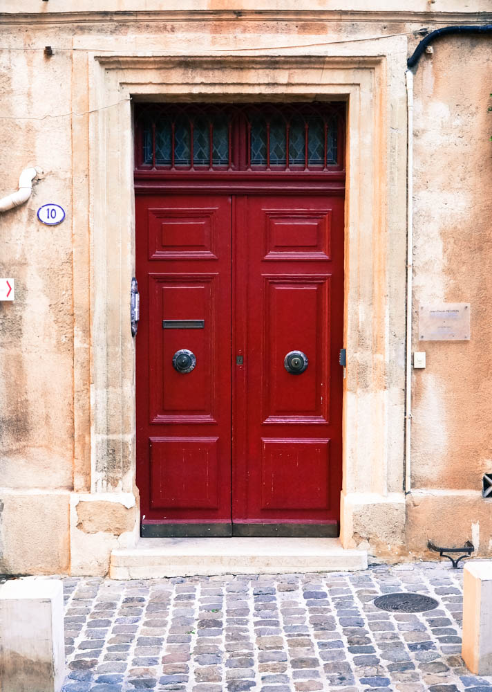 red door on building in aix en provence france