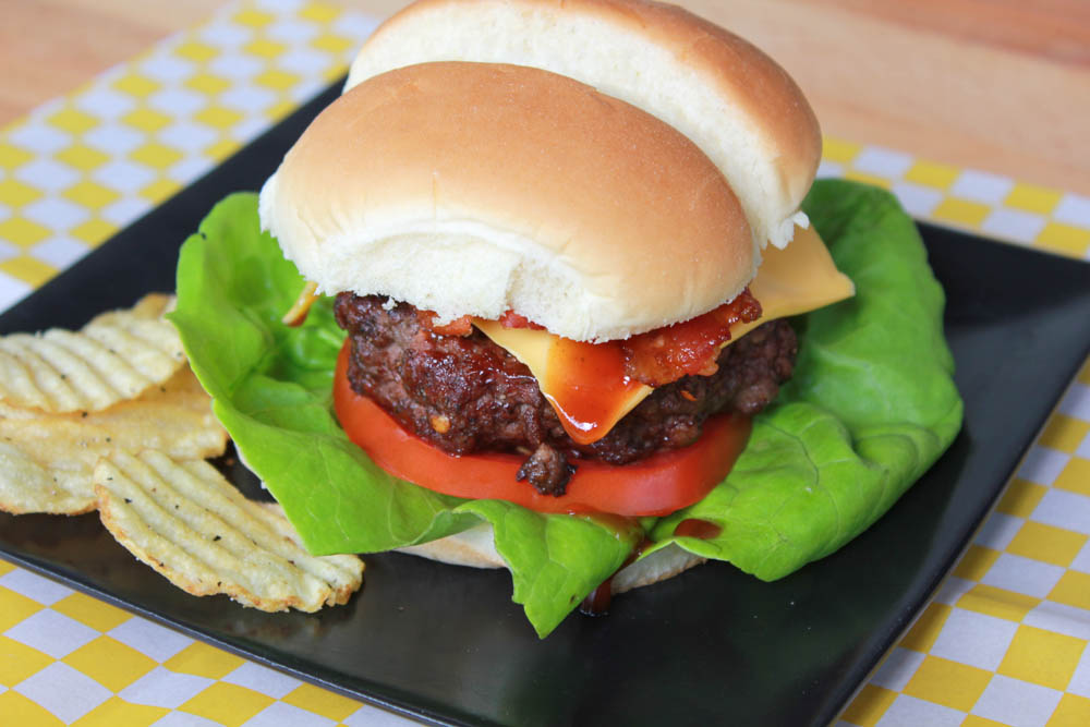 Fire up the grill and enjoy an All American Grilled BBQ-Bacon Cheeseburger!