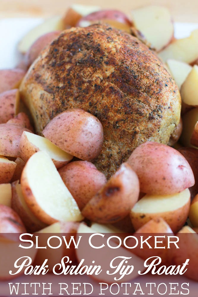 A beautiful array of Slow Cooker Pork Sirloin Tip Roast with Red Potatoes on a plate