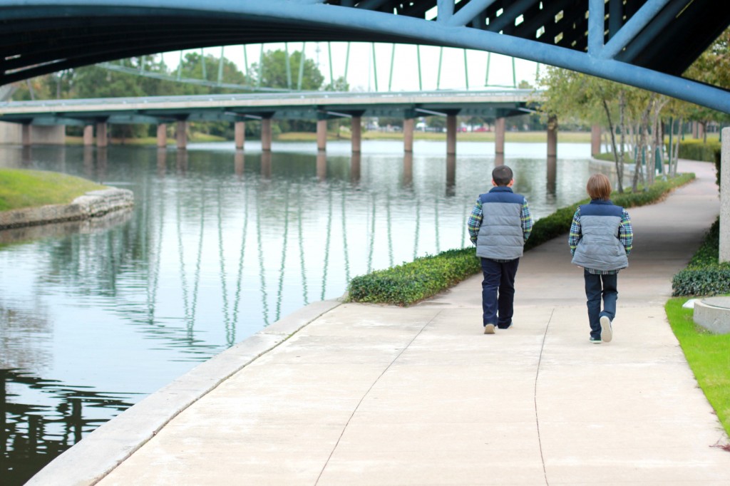 boys walking woodlands waterway in gymboree