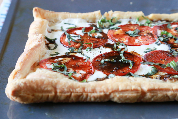 Making this Easy Caprese Pizza will be the best thing you did for yourself today. Made with Puff Pastry, it's the easiest pizza you'll ever make!