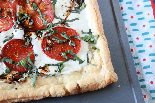 Making this Easy Caprese Pizza will be the best thing you did for yourself today. Made with Puff Pastry, it's the easiest pizza you'll ever make!