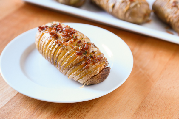 Hasselback Potatoes are a household favorite. Take yours to the next level by adding some bacon and cheese to create these Bacon & Cheese Hasselback Potatoes.