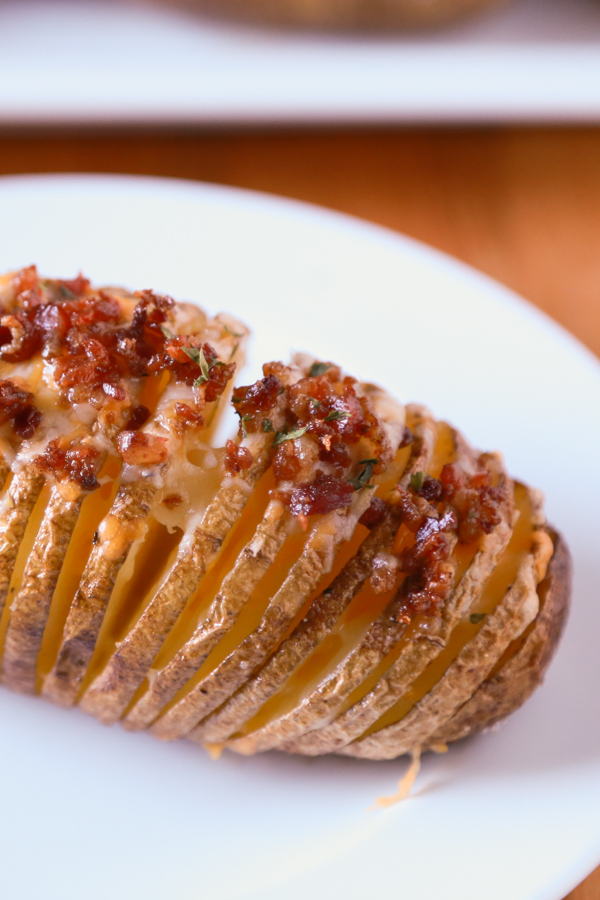 Hasselback Potatoes are a household favorite. Take yours to the next level by adding some bacon and cheese to create these Bacon & Cheese Hasselback Potatoes.