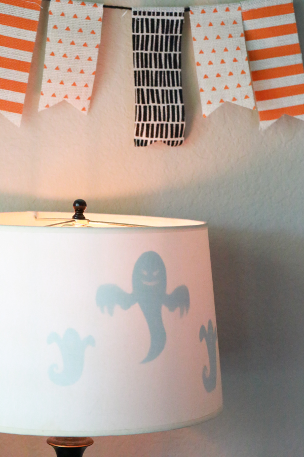 Get the right amount of spooky with this Spooktacular Ghost Lamp Shade. Such a simple way to decorate for Halloween.