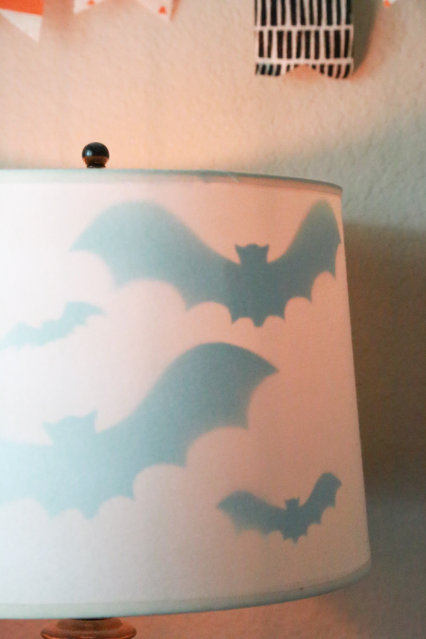 Get the right amount of spooky with this Halloween Bat Lamp Shade. Such a simple way to decorate for Halloween.