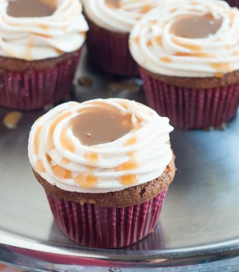 Love Caramel Apples? Then you'll love these delicious Caramel Apple Cupcakes featuring your favorite fall flavors! Get the recipe.