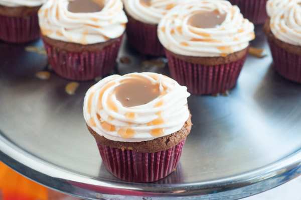 Love Caramel Apples? Then you'll love these delicious Caramel Apple Cupcakes featuring your favorite fall flavors! Get the recipe.