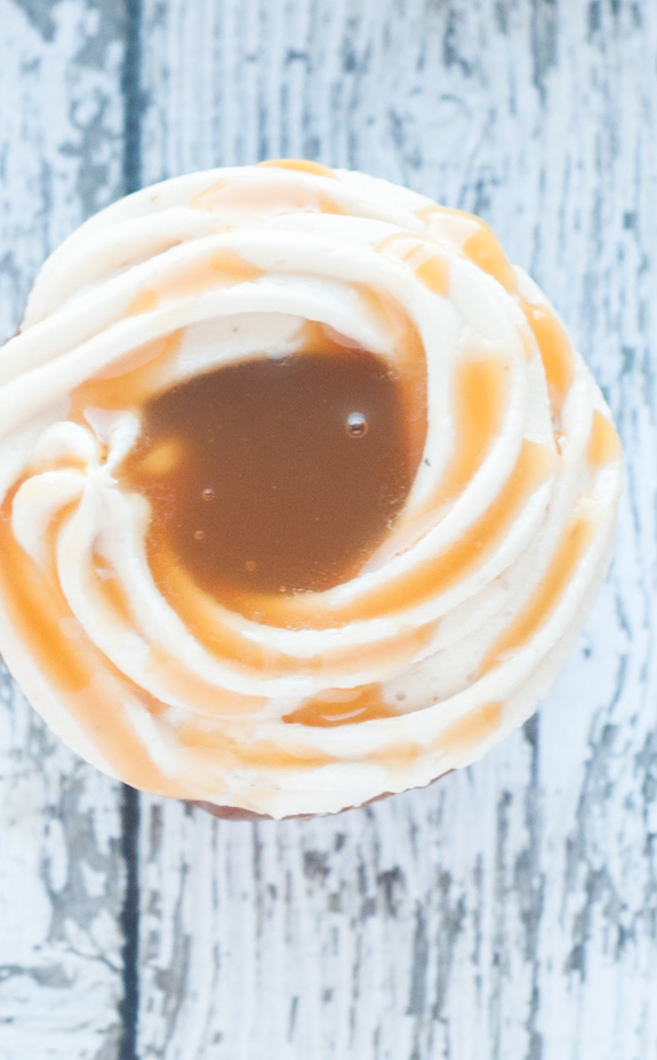 Love Caramel Apples? Then you'll love these delicious Caramel Apple Cupcakes featuring your favorite fall flavors! Get the recipe.