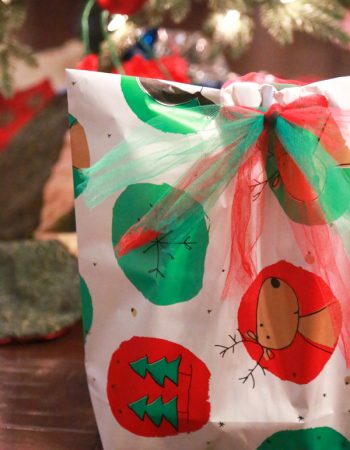 Need to wrap an odd-shaped present and don't have a gift bag at home. Make your own DIY Gift Bag from wrapping paper with this easy to follow tutorial.