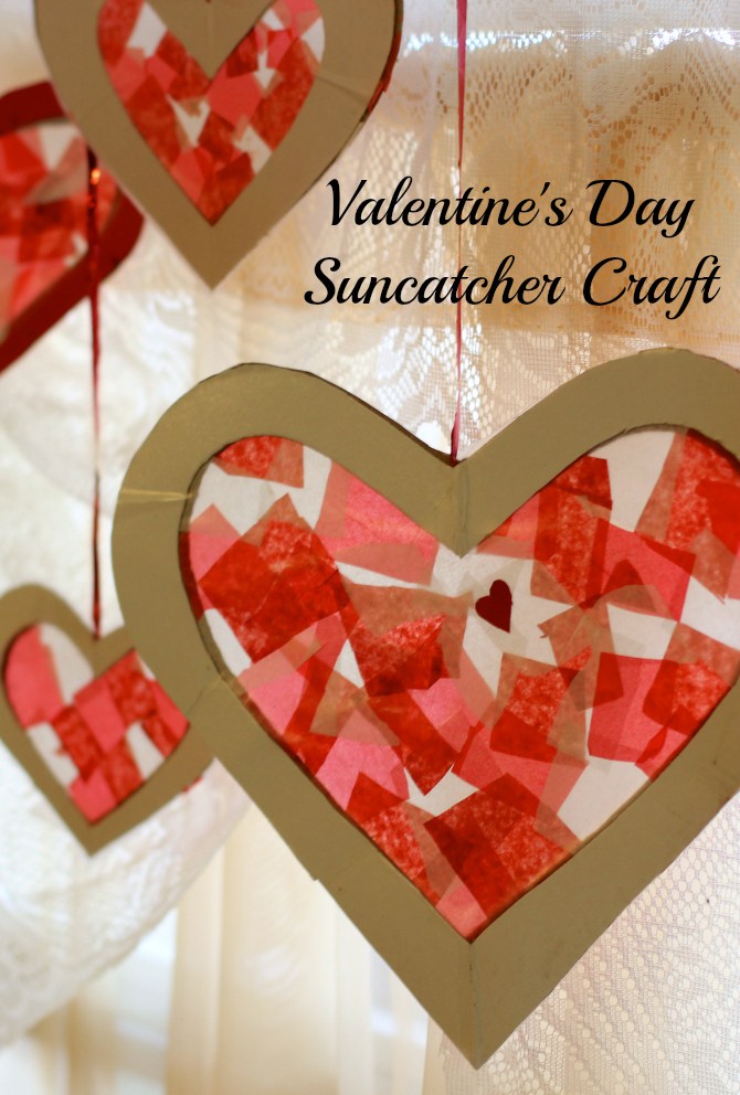 a heart-shaped suncatcher made with cut colored tissue paper