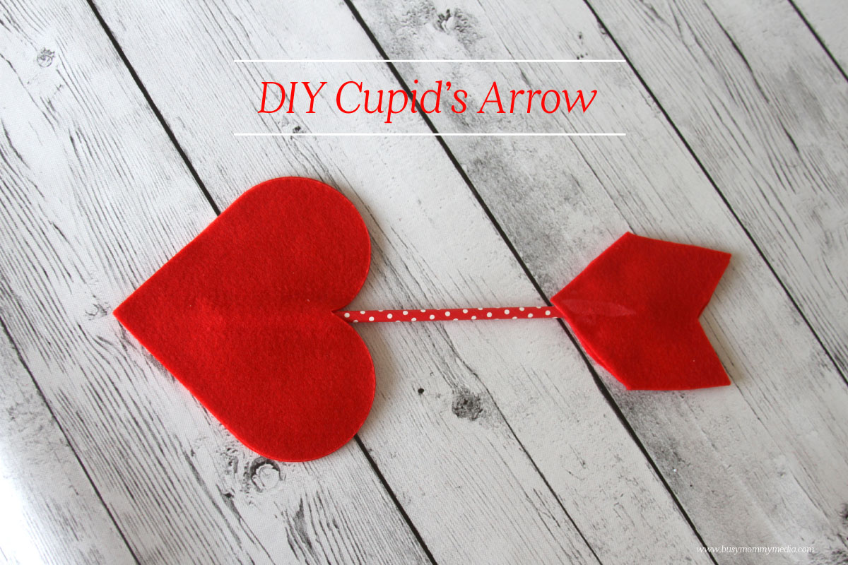 a cupids arrow using felt and a colored straw