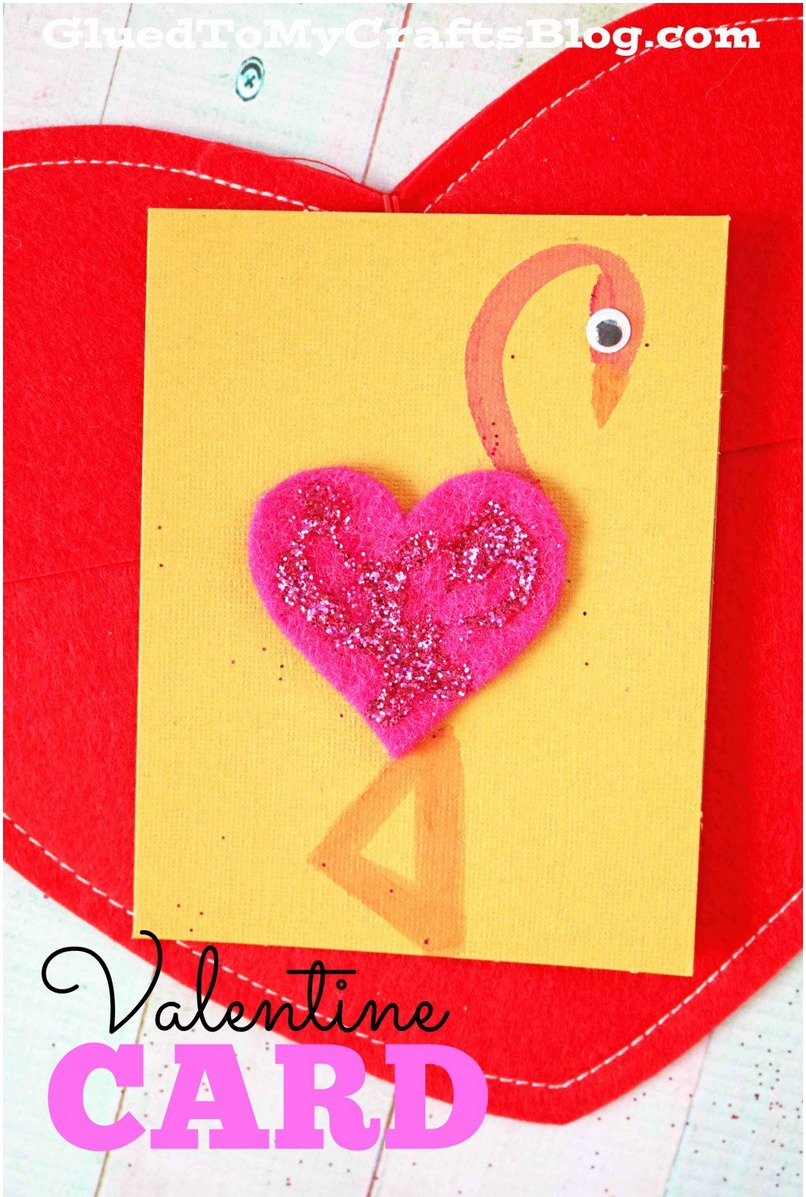 a valentines day card with a homemade flamingo on front made with felt and paint