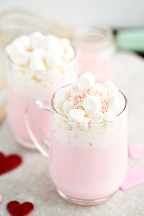 Celebrate Valentine's Day with this warm-you-up, delicious Pink Hot Chocolate. It's super simple to make.