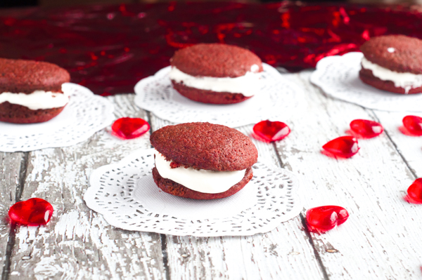 Nothing says Happy Valentine's Day like these Red Velvet Mini Whoopie Pies with Marshmallow Cream Cheese Frosting right in the middle. So yummy!