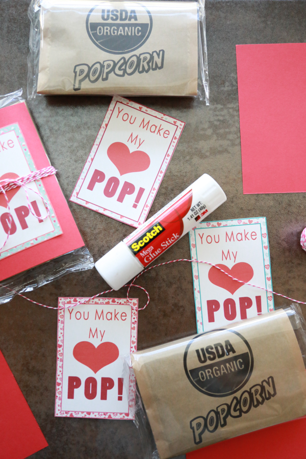 You Make My Heart Pop Valentines printable tied around an unpopped bag of popcorn!