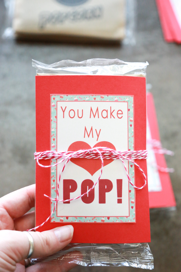You Make My Heart Pop Valentines printable tied around an unpopped bag of popcorn!