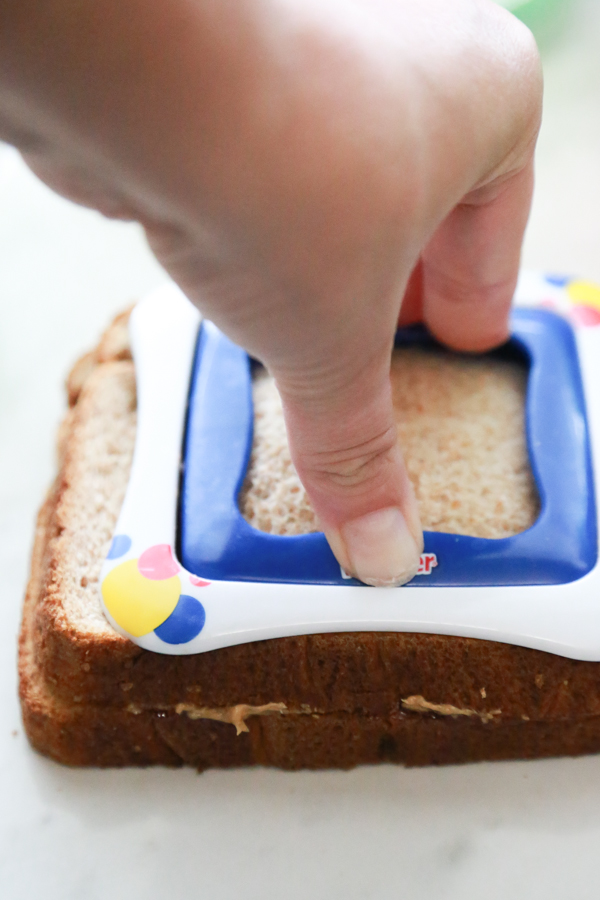 Help them power through their day with these super Easy PB&J Uncrustables on wheat bread.