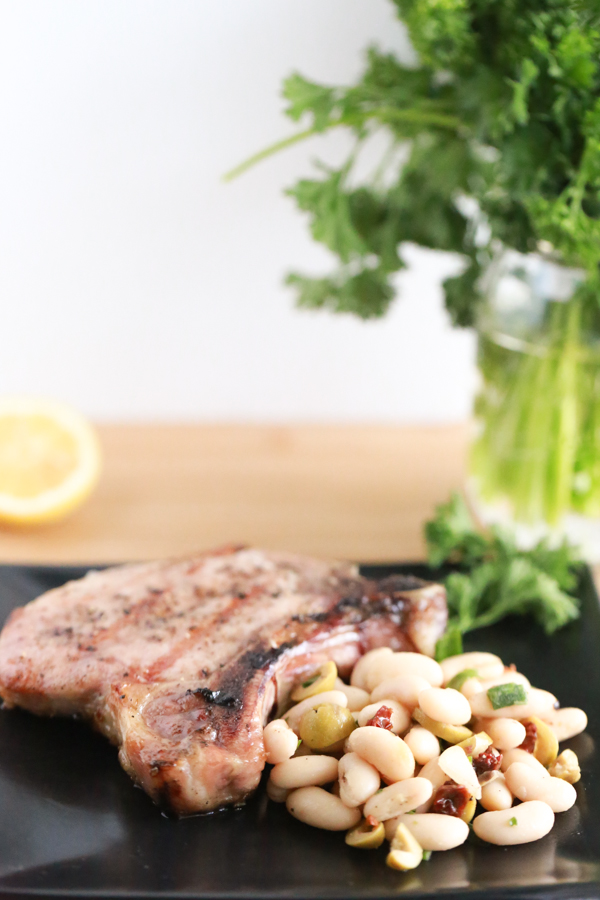 Fire up the grill and make these delicious Grilled Pork Chops with Tuscan Bean Salad.