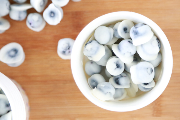 For a fun, popable treat this summer, enjoy these Homemade Yogurt Covered Blueberries. So easy to make and they taste delicious.