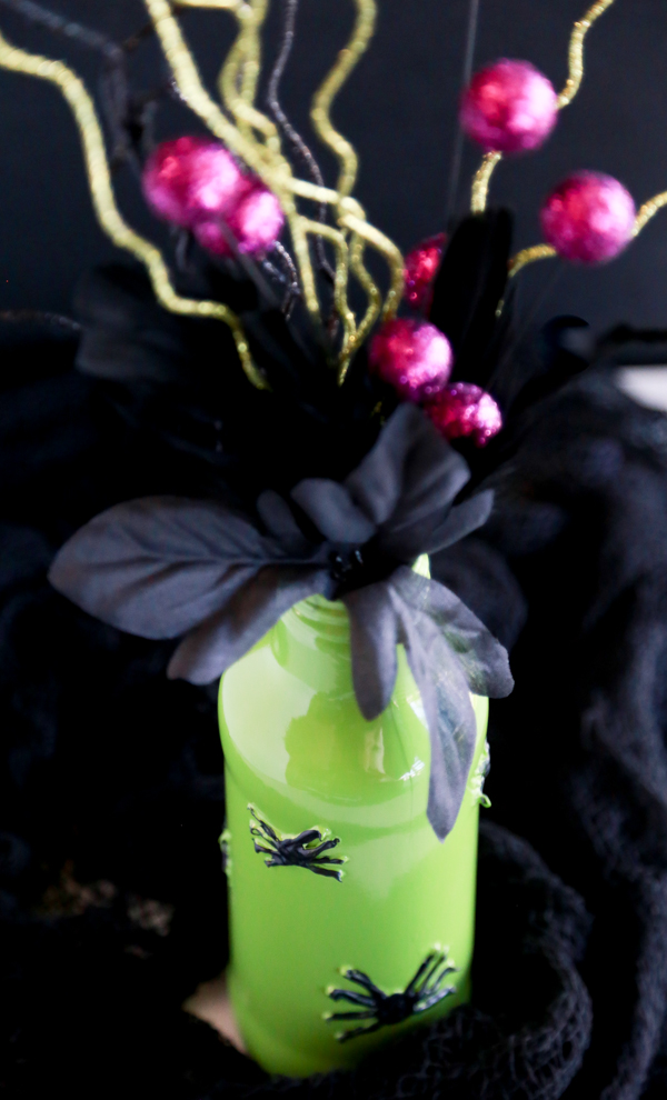 See how you can turn a glass beverage bottle into a spooky Painted Spider Vase for Halloween.