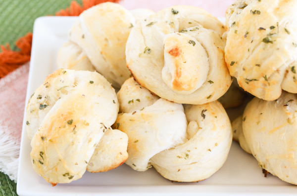 Turn refrigerated biscuit dough into these buttery Easy Garlic Parmesan Knots that melt right in your mouth. You won't be sorry that you did - I promise.