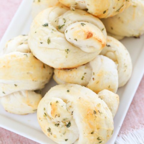 Turn refrigerated biscuit dough into these buttery Easy Garlic Parmesan Knots that melt right in your mouth. You won't be sorry that you did - I promise.