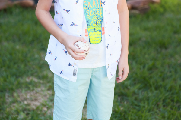 a little boy holding a baseball wearing a spring styles from oshkosh bgosh - perfect spring styles at oshkosh b'gosh