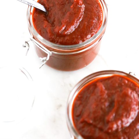 two jars full of homemade texas bbq sauce