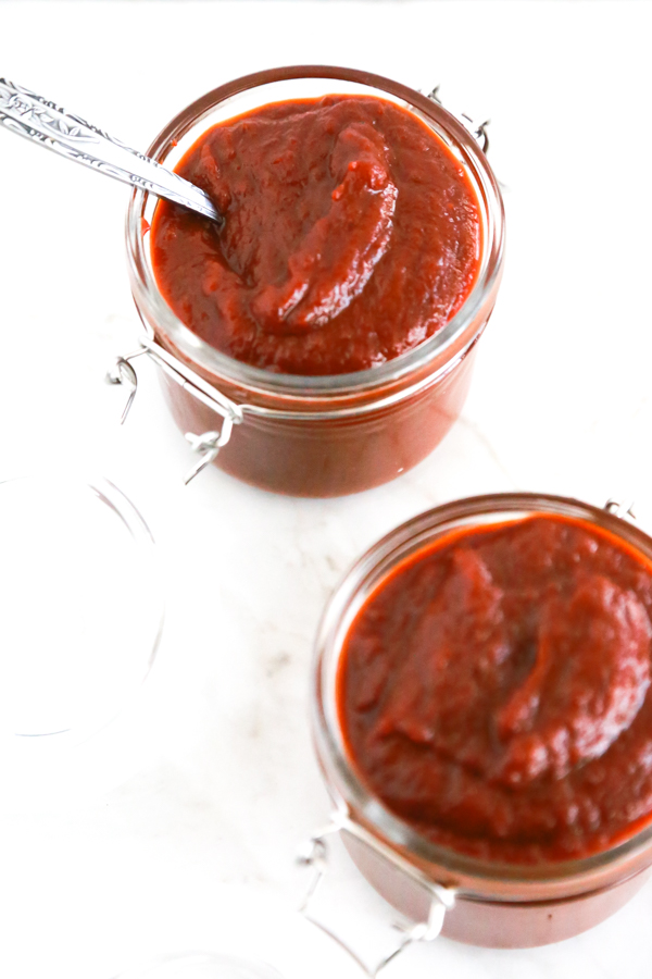 two jars full of homemade texas bbq sauce