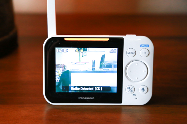 the panasonic long-range baby monitor in use on a wooden table in a home