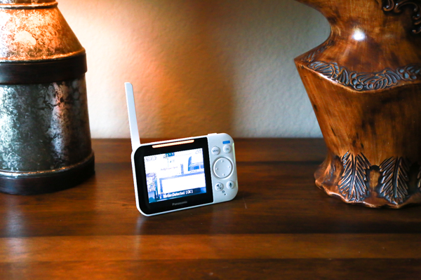 the panasonic long-range baby monitor in use on a wooden table in a home