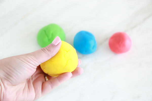 four balls of homemade marshmallow play dough makes a great kids craft and activity