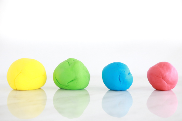 four balls of homemade marshmallow play dough makes a great kids craft and activity